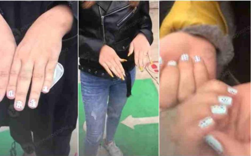 Aspirantes a maestras se pintan las respuestas en las uñas