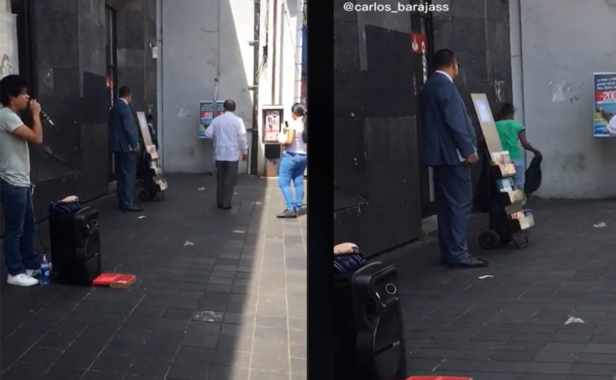 Gente viendo como una mujer pelea con una rata